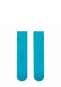 Calzini turchesi con una texture liscia, caratterizzati da una suola con motivo e un logo Jumpman viola vicino al risvolto.