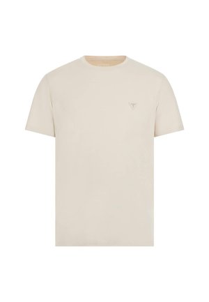 Tricou bej cu mânecă scurtă, confectionat dintr-un material moale, având un mic logo triunghiular embosat pe partea stângă a pieptului. Textură netedă.