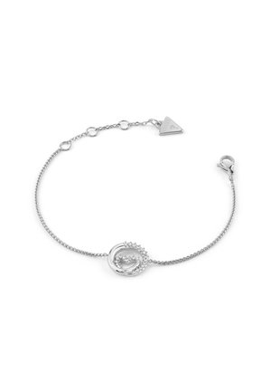 Braccialetto in argento con charm circolare decorato con rhinestones, finitura liscia e un'etichetta triangolare con chiusura a moschettone.