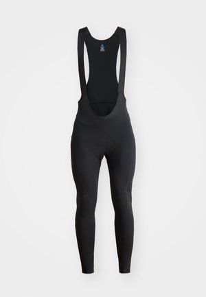 Calças de ciclismo pretas com alças, tecido elástico e área de assento almofadada. Textura suave com costuras planas para maior conforto.