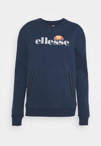Donkerblauwe sweatshirt met het "ellesse"-logo in wit en oranje op de borst, met twee verticale zakken met rits aan de voorkant.