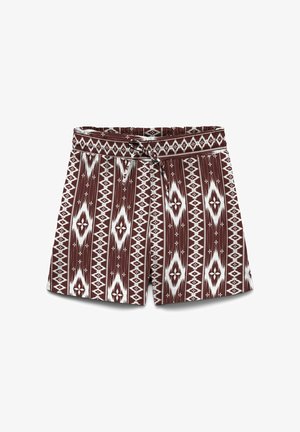 Bruine en witte korte broek met een patroon van geometrische diamantvormen en een tailleband met trekkoord.