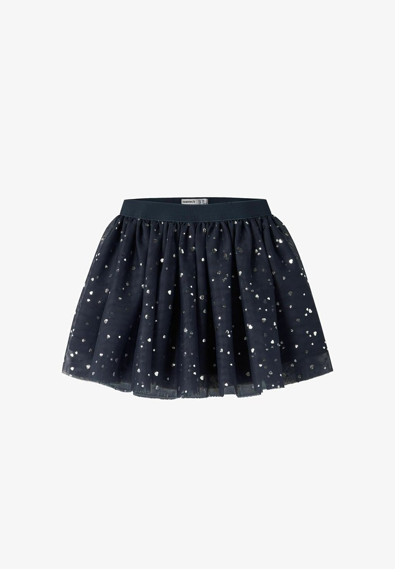 Jupe en tulle bleu marine avec des pois en sequins argentés, taille élastique froncée et tissu superposé pour plus de volume.