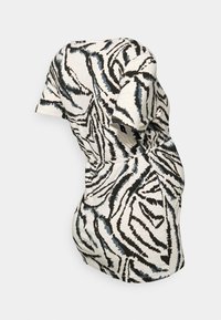 T-shirt de maternidade com uma base creme e estampa de zebra em preto e azul. Mangas curtas, franzido lateral e um corte descontraído.