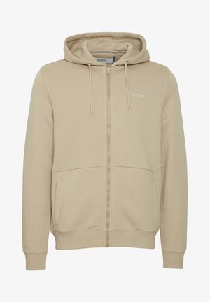 Bežs kapuces džemperis ar rāvējslēdzēju, izgatavots no kokvilnas maisījuma auduma, ar regulējamu kapuci, divām priekšējām kabatām un smalku logotipa detalizāciju uz krūšu.