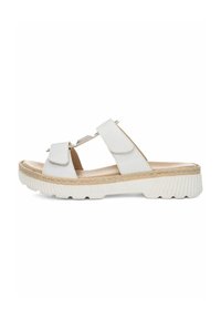 White sandals featuring two adjustable straps, a textured upper, and a thick white sole with jute accents, designed for comfort and support.