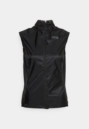 Veste coupe-vent noire sans manches avec col montant et fermeture éclair à l'avant, avec un petit logo "GORE" sur le haut gauche de la poitrine.