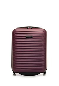 Hard-shell suitcase in deep purple, featuring horizontal ridges, a black zipper, and a logo plate. Four wheels for easy mobility.