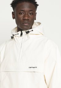 Carhartt WIP Corta-vento - beige