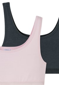 Two sleeveless crop tops in soft cotton material. One is pale pink, and the other is dark gray, featuring wide straps and a basic design.