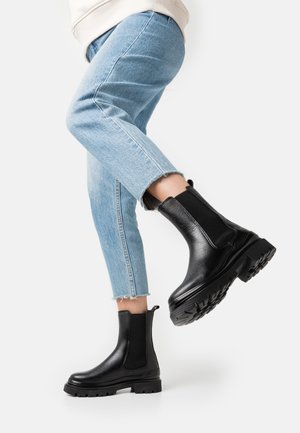Enkellaarsjes met plateauzool - black