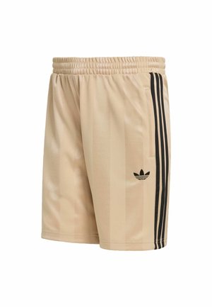 Pantaloncini sportivi beige con strisce verticali nere, fascia elastica in vita e un piccolo logo nero sulla gamba sinistra. Texture liscia e design aderente.