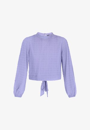 Lavender long-sleeve blouse with a textured grid pattern, high neckline, and tie detail at the waist. Smooth fabric with a relaxed fit.