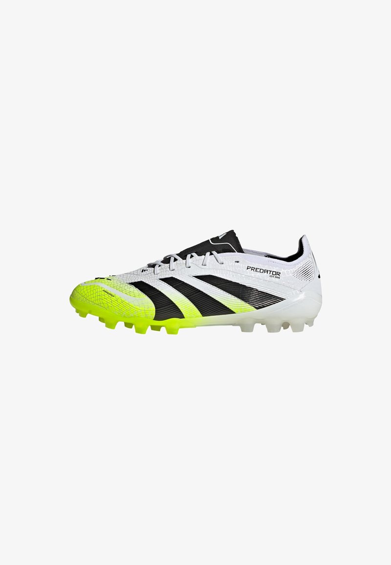 White and neon yellow Adidas Predator soccer cleat with black stripes and molded studs, side view on a white background.