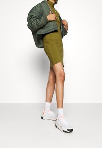 Nike Sportswear Žerzejové šaty - khaki