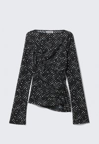 Μαύρο μακρυμάνικο τοπ με λευκές πουά, διαθέτει σχεδιασμό με πέπλο και σύσταση με πτυχώσεις στη μια πλευρά. Η ετικέτα γράφει "WEEKDAY."