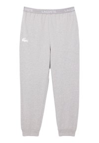 Svetlosive Lacoste trenirke z elastičnim pasom, ki vsebujejo besedilo "LACOSTE" in bel krokodilov logotip na levi stegnu.