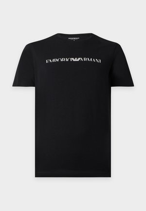 Czarny t-shirt z krótkim rękawem z białym logo Emporio Armani i symbolem orła umieszczonym na środku klatki piersiowej.