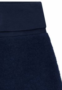 Marineblaue Jogginghosen mit einer weichen, filzartigen Textur und einem gerippten elastischen Bund. Der Stoff ist dick und gemütlich, ideal für Freizeitkleidung.