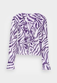 Blusa de mangas longas roxa e branca com riscas de zebra, apresentando detalhes em folhos ao longo do decote e à frente, design cropped e punhos amplos.