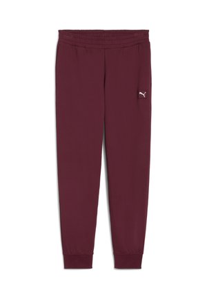 Pantalon de sport bordeaux avec une taille élastique, des poignets côtelés et un petit logo blanc sur la cuisse gauche. Fabriqué en matériau doux et extensible.
