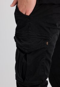 Alpha Industries TWILL JOGGER - Kapsáče - black