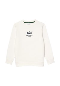 Hvit sweatshirt laget av bomull med rund hals. Har et marineblått Lacoste-logo og "PARIS" tekst på brystet. Klassisk passform.
