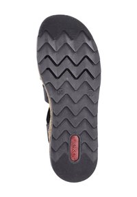 Semelle en caoutchouc noir avec un motif de crête en zigzag et un détail de logo en relief rouge. Taille "37" estampillée sur le côté. Fini texturé pour une meilleure adhérence.