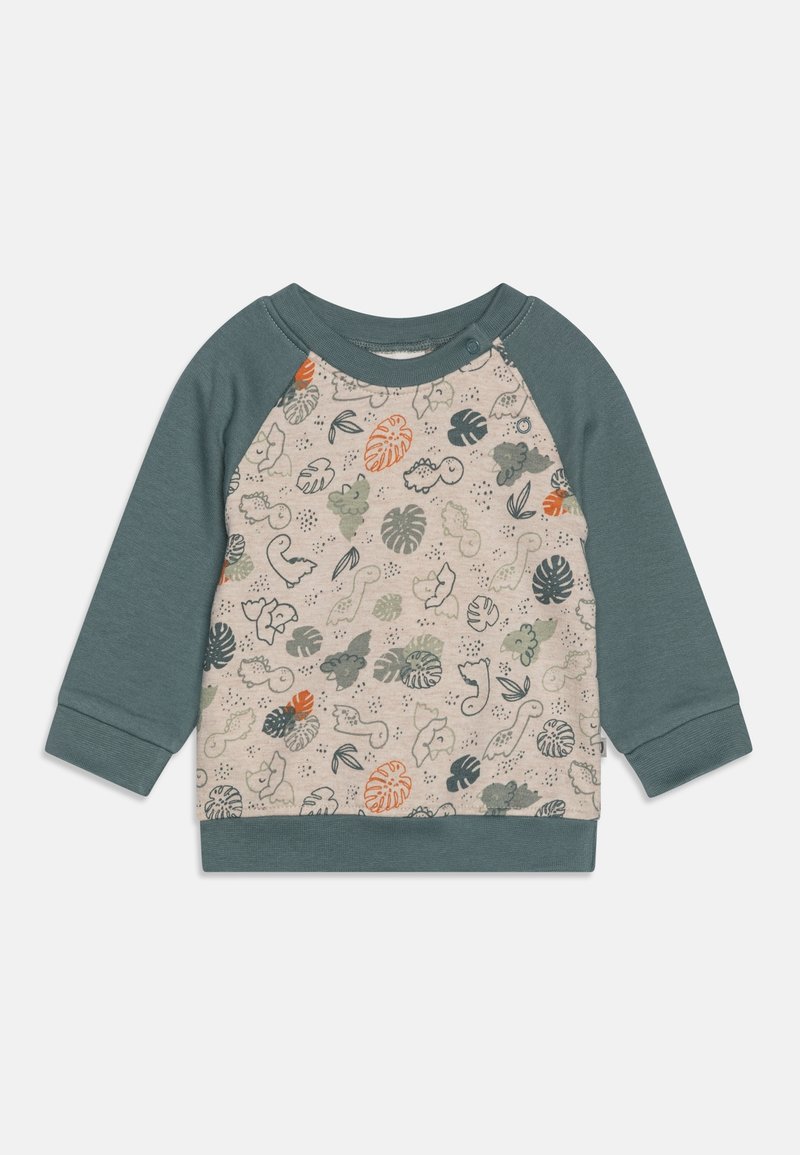 Sweat-shirt à manches longues pour tout-petit avec des manches raglan vertes douces et un panneau avant beige imprimé de formes de feuilles orange et vertes et de dinosaures.