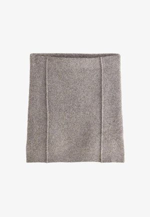 Hallikas tundlik kangas, millel on pehme tekstuur, sisaldab kahte vertikaalset õmblust struktuuri jaoks. Servaline kuju, nähtava riistvara või mustriteta.