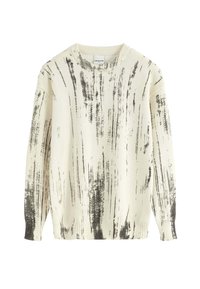 Pull léger en crème avec des rayures noires. Il présente un col rond, des manches longues et des poignets et un ourlet côtelés. Fabriqué en tissu tricoté doux.