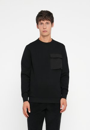 Black sweatshirt with long sleeves, crew neck, and a front patch pocket. Made from soft fabric with ribbed cuffs and hem.