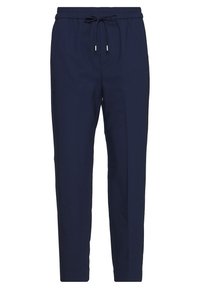Pantalons de jogging bleu marine en tissu doux, avec une taille élastique et un cordon de serrage, et des jambes fuselées, offrant une coupe décontractée.