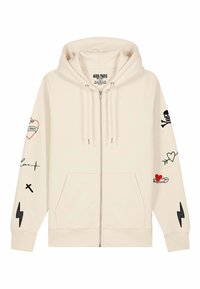 Felpa con zip di colore crema, dotata di cappuccio regolabile con coulisse. Presenta vari stampati grafici in nero e rosso, tra cui cuori e un motivo di teschio.