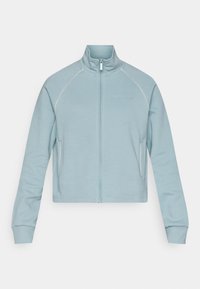 Lyseblå langærmet zip-up træningsjakke med høj krave, sidelommer, ribbede manchetter og lille "ONLY PLAY" logo på brystet.