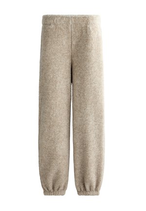 Fleece-Sweathosen in sanftem Beige mit elastischem Bund, konischen Bündchen und einer strukturierten Oberfläche für Wärme und Komfort.
