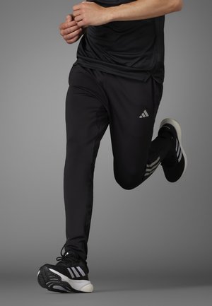 adidas Performance OWN THE RUN ASTRO SEAMLESS KNIT - Tracksuit bottoms - black