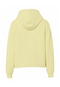 Sweat à capuche jaune avec une coupe décontractée, épaules tombantes, poignets et ourlet côtelés. Texture du tissu lisse, sans motifs ni éléments métalliques visibles.