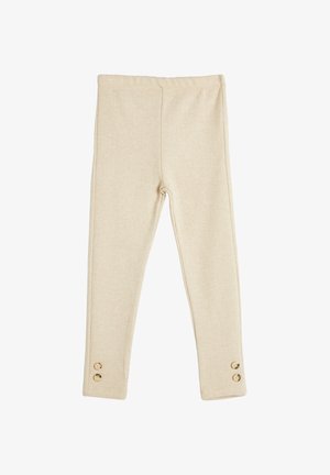 Legginsit beige-kalan malli, joissa on tiukka istuvuus, turvallinen vyötärö ja kaksi kultanappia helman lähellä.