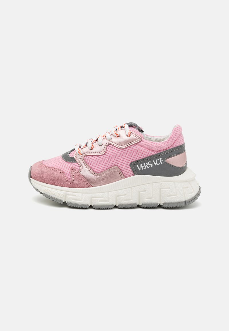 Pink sneaker with mesh and suede materials, white sole with a textured pattern, gray accents, and orange laces. Logo visible on the side.