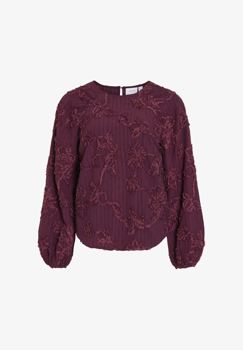 Burgundy blus med texturerad blommig broderi, ballongärmar, ribbat tyg och nyckelhålsstängning bak.