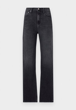 Jean noir à jambes droites en denim, avec une taille haute, cinq poches et une fermeture éclair avec un bouton. Légèrement délavé.