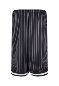 Shorts de basket à rayures noires et blanches avec une ceinture élastique, un tissu anti-humidité, et des bords unis noirs au niveau de l'ourlet.