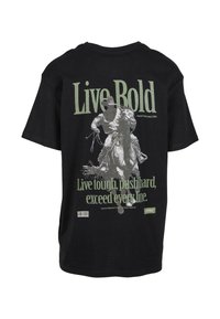 Black cotton t-shirt featuring a large printed graphic of a cowboy riding a horse, with green text reading "Live Bold" and a slogan below.
