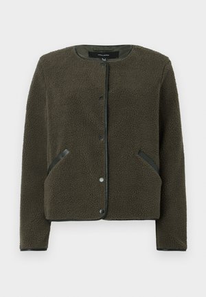 Fleece jacket in dark olive green with a textured surface, round neckline, snap buttons, and black accent patches on pockets.