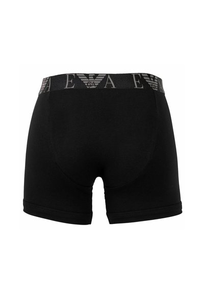 Zwarte boxershorts met een contrasterende elastische tailleband met een logo. Gladde, elastische stof met een aansluitend ontwerp en naadloze randen.