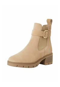 Bottine en daim beige avec bout rond, panneaux élastiques latéraux, accent en boucle sur la sangle et talon carré texturé.