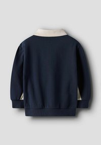 Giacca blu navy con colletto color crema, polsini e orlo a coste. Realizzata in tessuto liscio, presenta una vestibilità morbida e un design semplice.