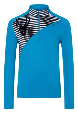 Blå langærmet sportstrøje med sort og hvid striped panel, sort edderkoppegrafik på venstre bryst og kvart lynlås i kraven.