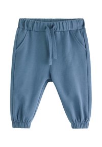 Blå sweatpants med elastisk talje, snøre og sidelommer. Taperede manchetter ved anklen og glat tekstur.